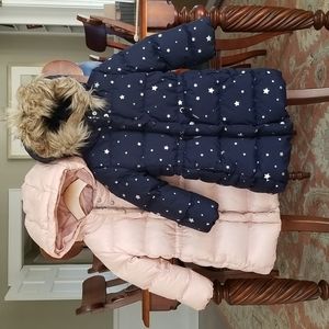 Girls puffer coat in navy blue and blush pink.